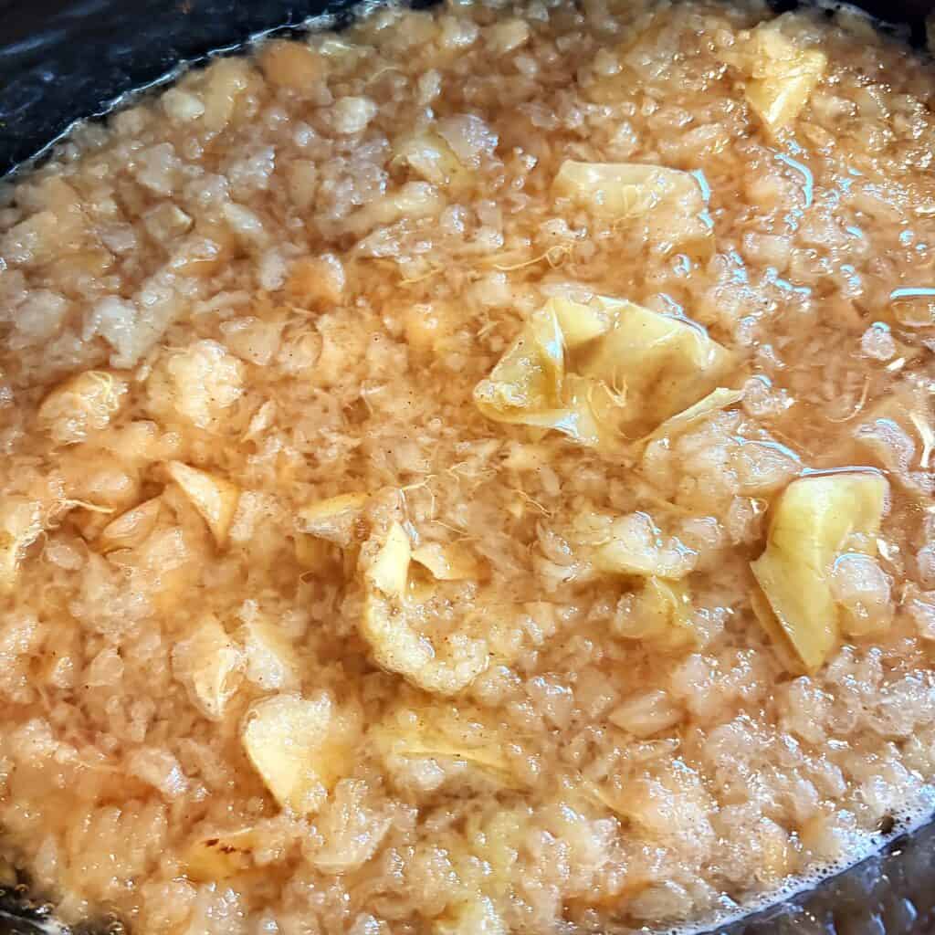 apple cider cooking in a slow cooker